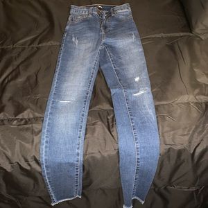One slit blue jeans